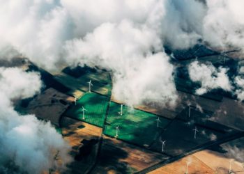 aerial photo of wind turbines near field
