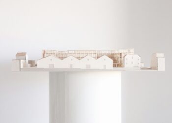 Architectural model of a building on a platform.