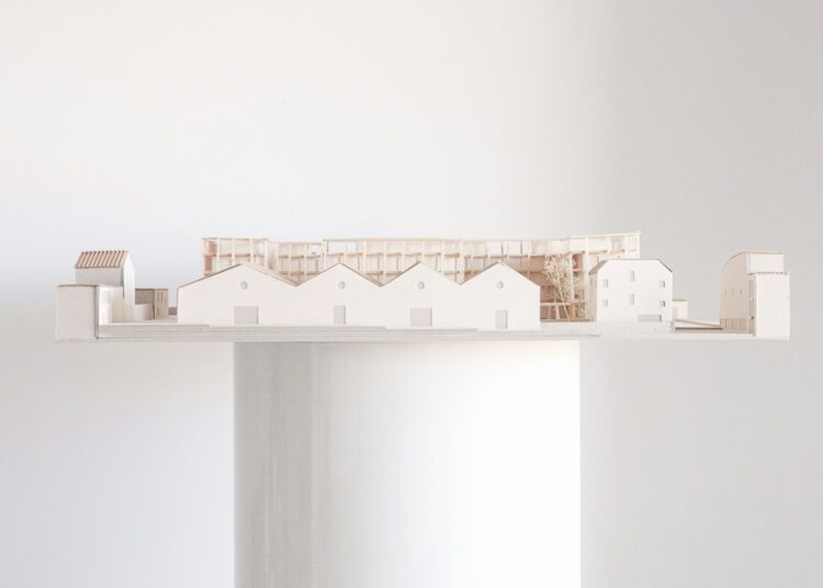Architectural model of a building on a platform.