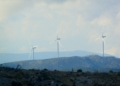 white wind turbines on green grass field during daytime