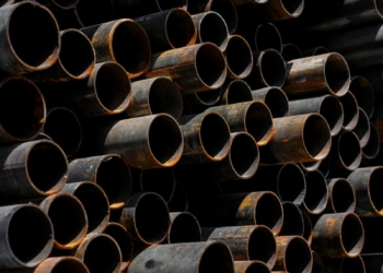 A large stack of pipes stacked on top of each other