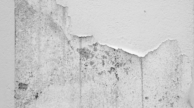 white concrete wall with hole