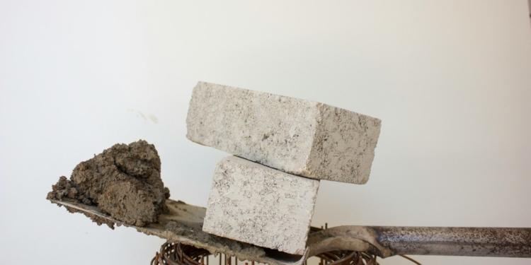 two gray blocks on shovel