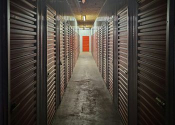 empty hallway with lights turned on in the middle