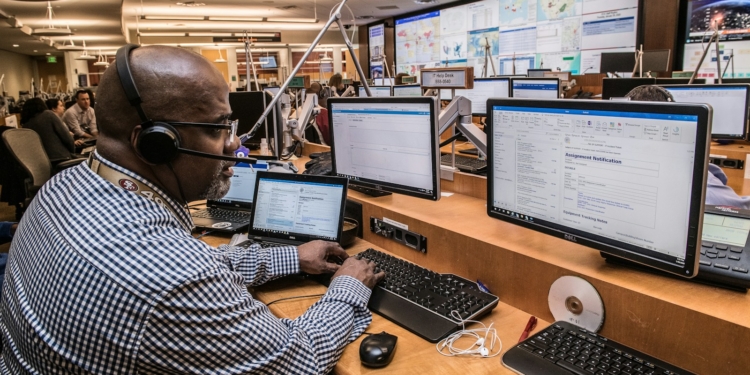 man in black and white checkered dress shirt using computer