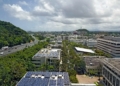 an aerial view of a city with solar panels