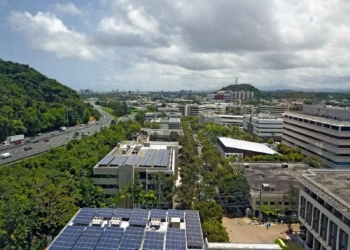 an aerial view of a city with solar panels