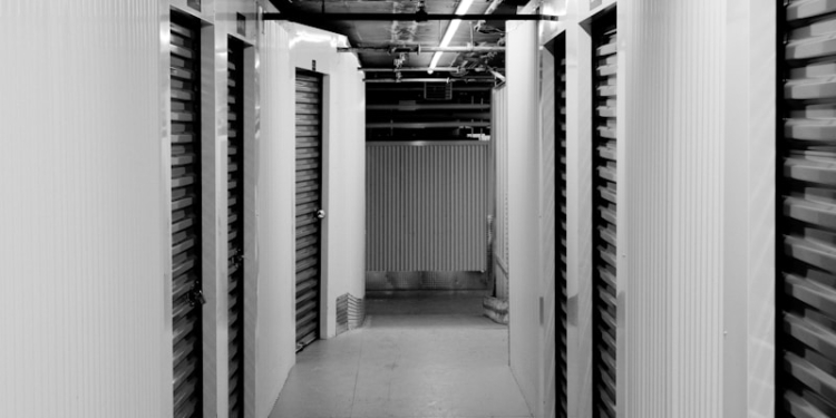 Empty hallway with storage units.