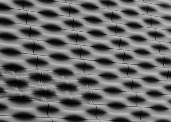 Abstract pattern of light and shadow on textured surface