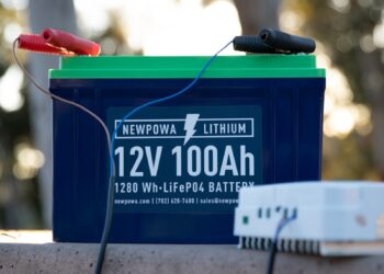a battery and a charger sitting on a bench