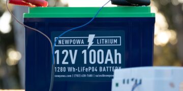 a battery and a charger sitting on a bench