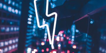 person taking selfie in front of mirror during night time